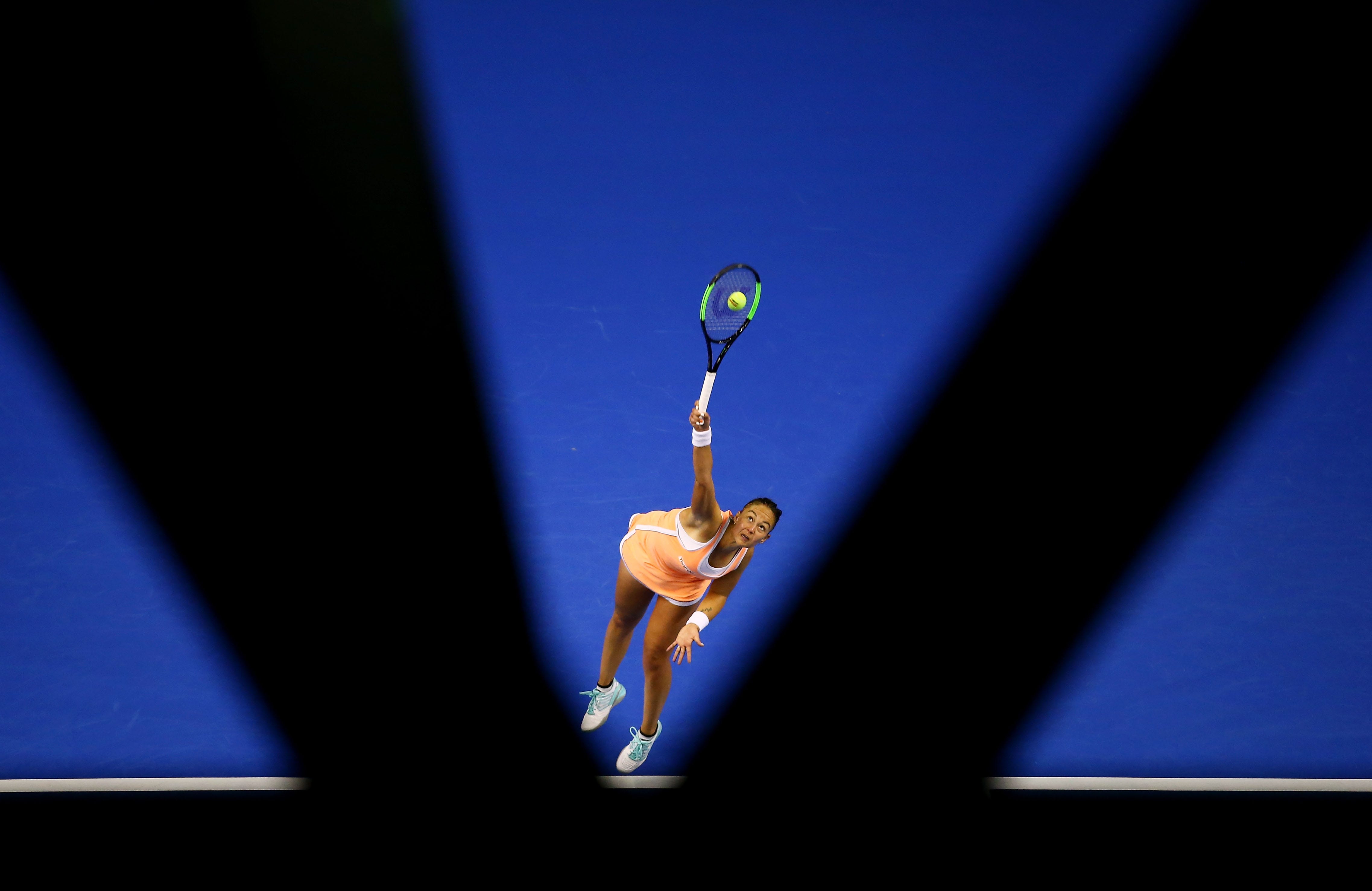 Lesley Kerkhove of the Netherlands serves in her match against Samantha Stosur of Australia during the World Group Play-Off Fed Cup tie between Australia and the Netherlands at the Wollongong Entertainment Centre in Wollongong, Australia.
