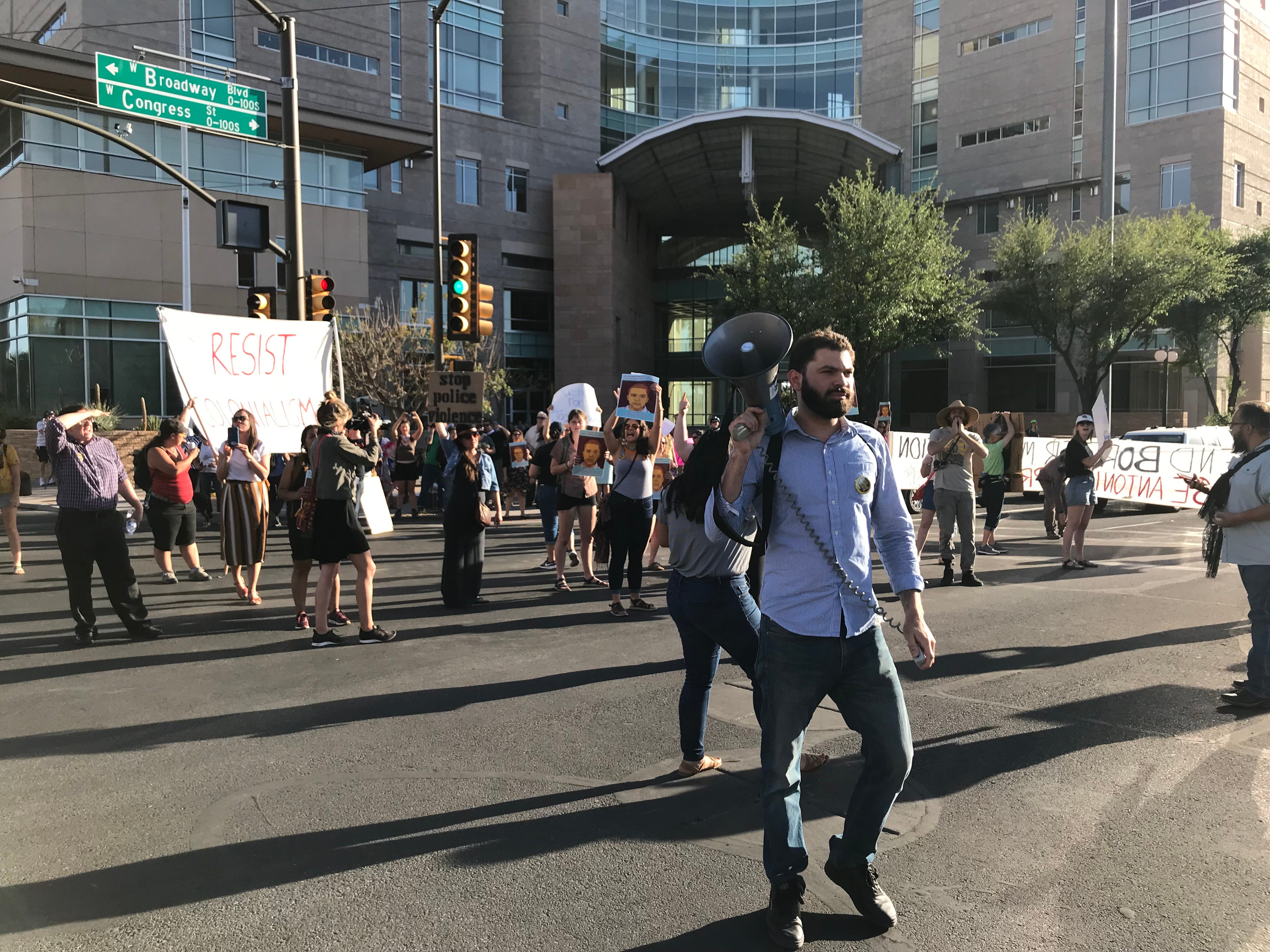 Protesters blocked off an intersection in front of Tucson’s federal courthouse on Monday to rally against a “not guilty” verdict in the slaying of an unarmed Mexican teenager at the hands of a Border Patrol agent.