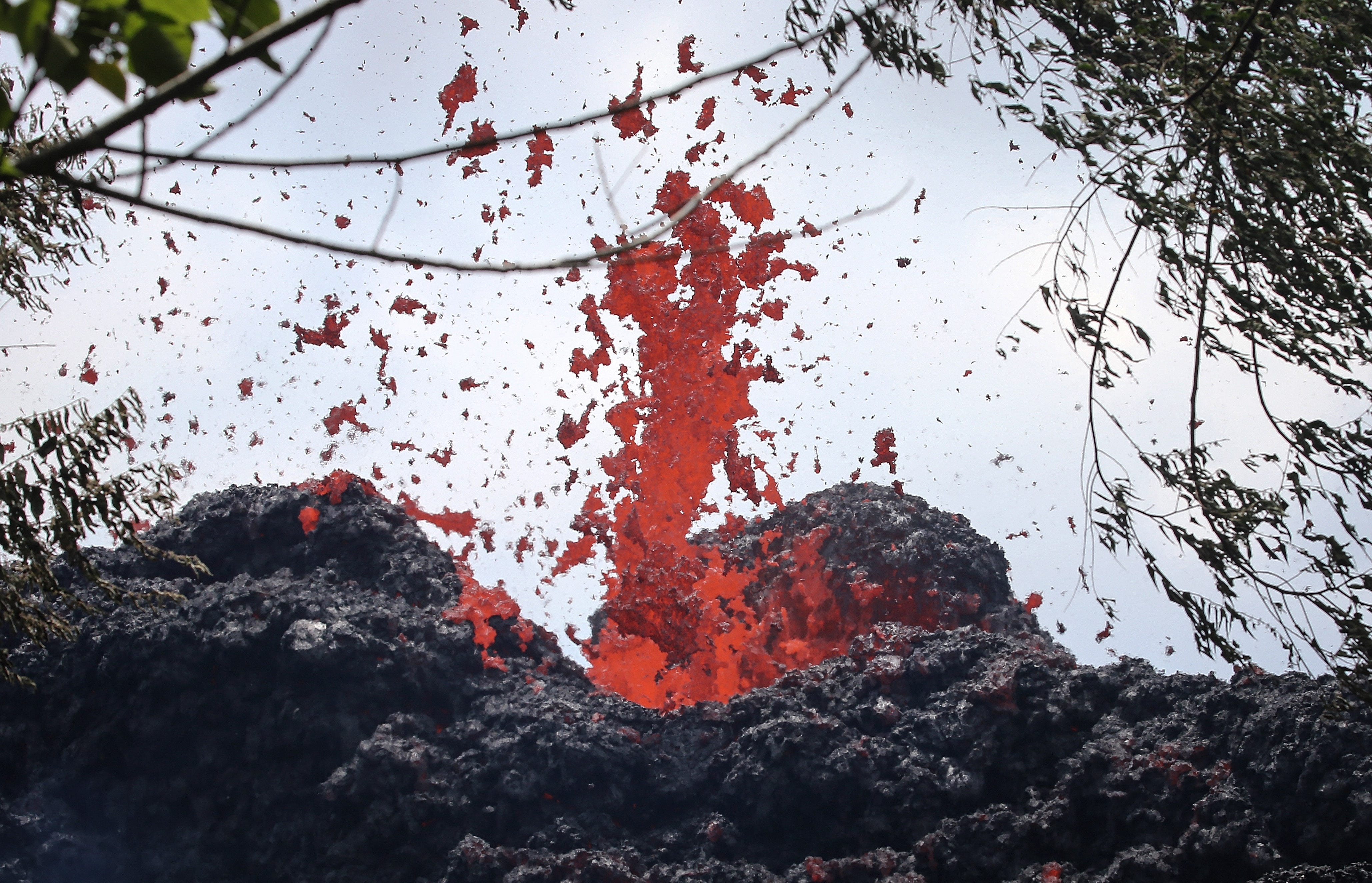 A lava fissure erupts in the aftermath of eruptions from the Kilauea volcano on Hawaii's Big Island, on May 12, 2018 in Pahoa, Hawaii. The U.S. Geological Survey said a recent lowering of the lava lake at the volcano's Halemaumau crater Ã'has raised 