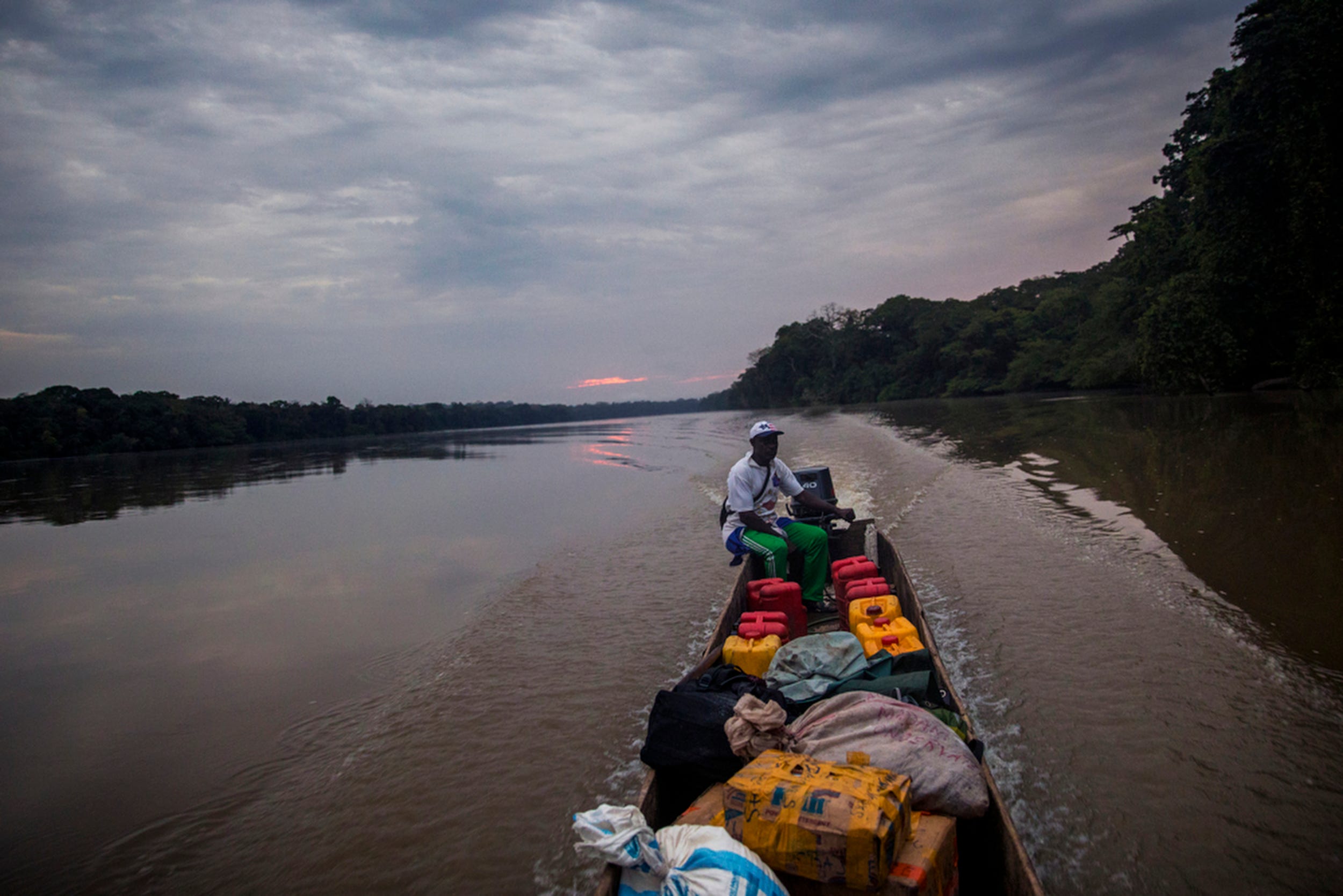 The sun slowly rises as we embark on our five-hour adventure down the Sangha River to the town of Ouésso.