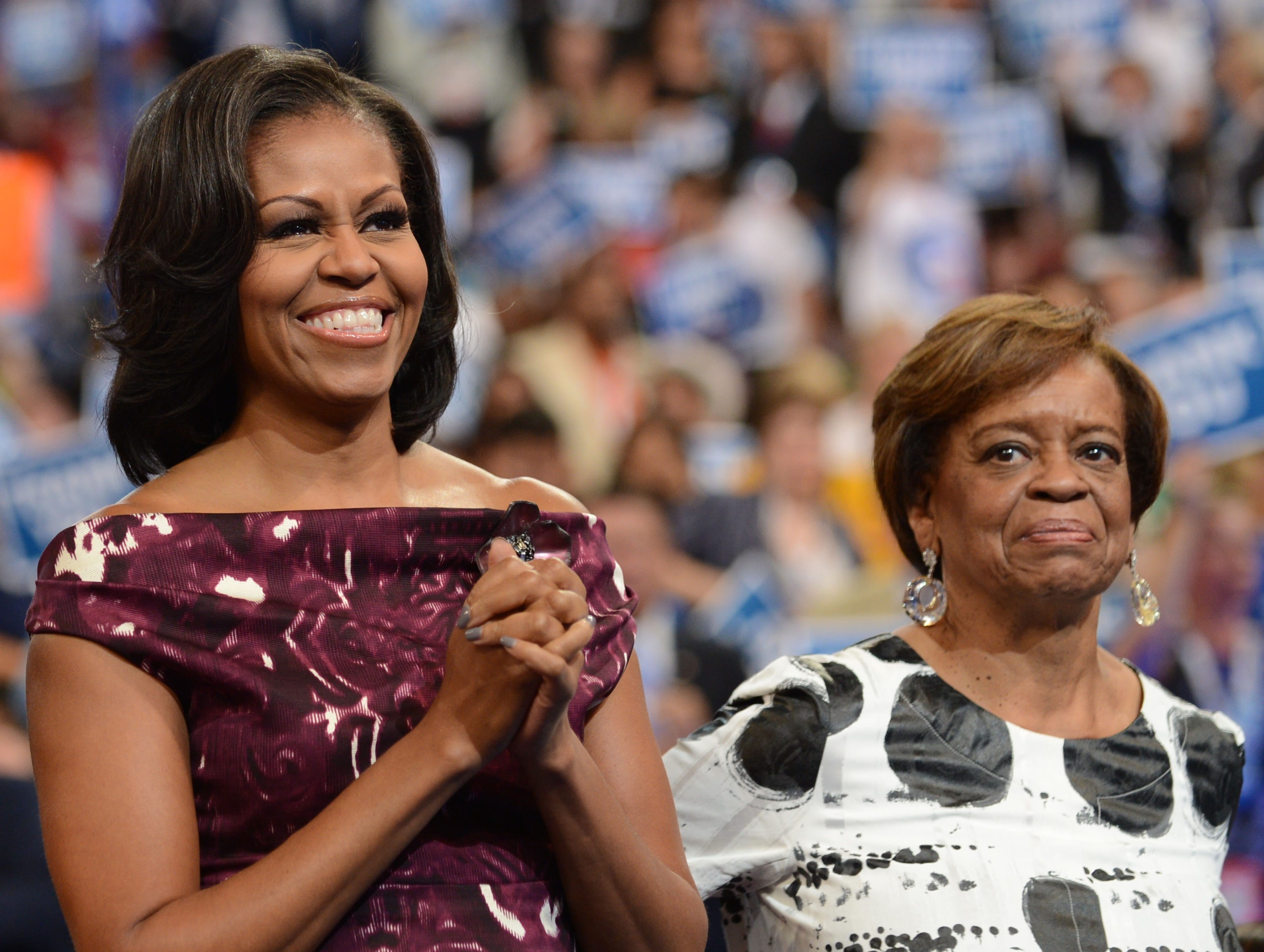 First Lady Michelle Obama and her mother Marian Robinson clap to a speech at the Time Warner Cable Arena in Charlotte, North Carolina, on September 6, 2012 on the final day of the Democratic National Convention (DNC). (Robyn Beck/AFP/Getty Images)