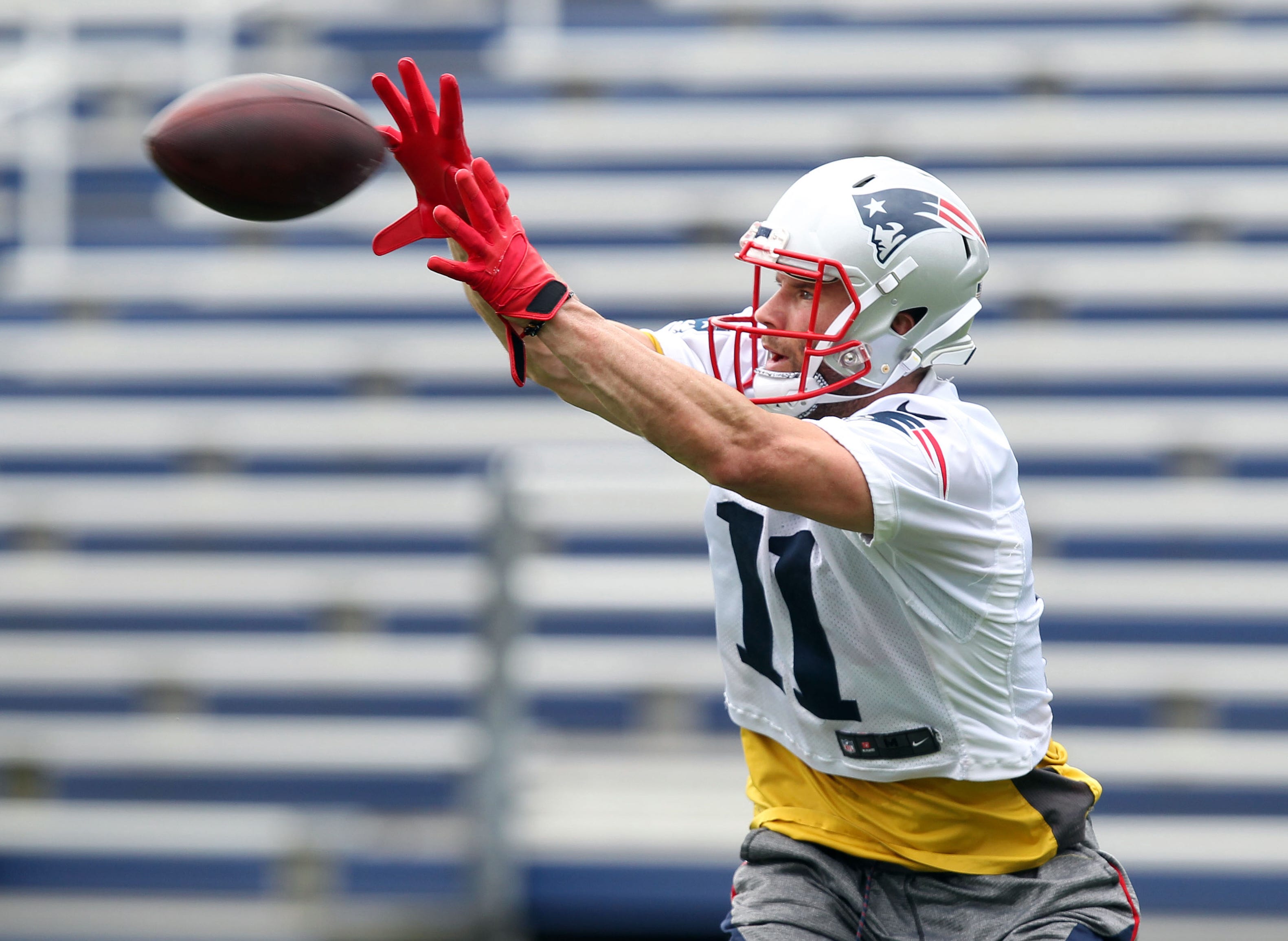 New England Patriots wide receiver Julian Edelman catches a pass during organized team activities at Gillette practice fields in Foxborough, Mass.