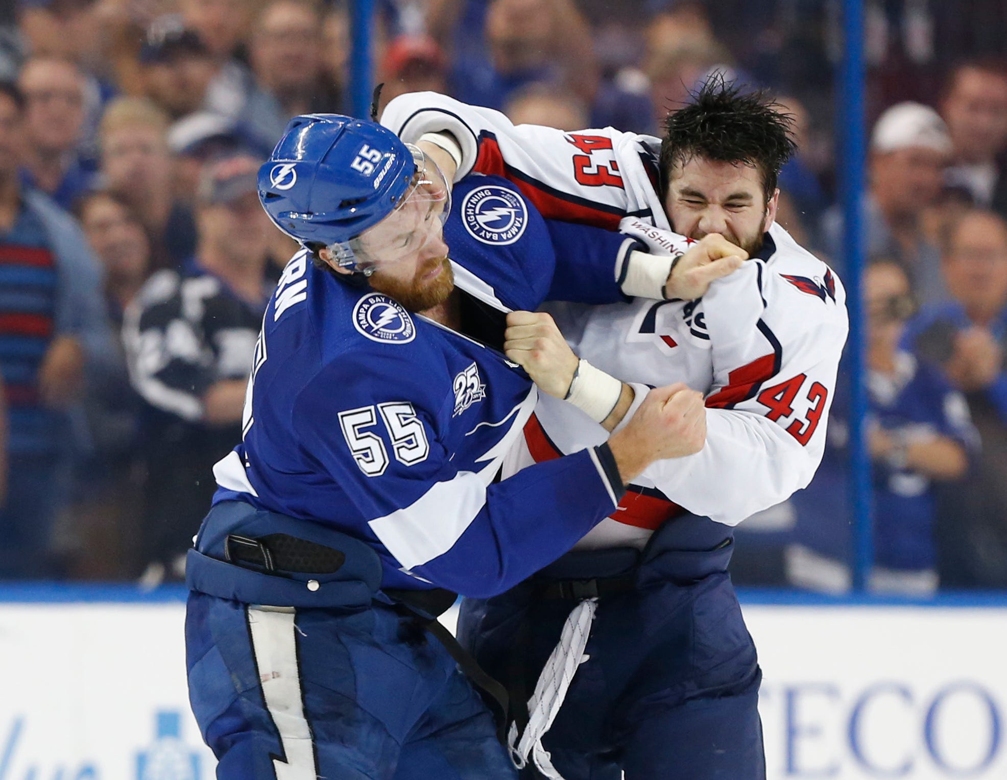Washington Capitals right wing Tom Wilson, right, fights with Tampa Bay Lightning defenseman Braydon Coburn in the first period in game seven of the Eastern Conference Final in the 2018 Stanley Cup Playoffs at Amalie Arena in Tampa, Fla.