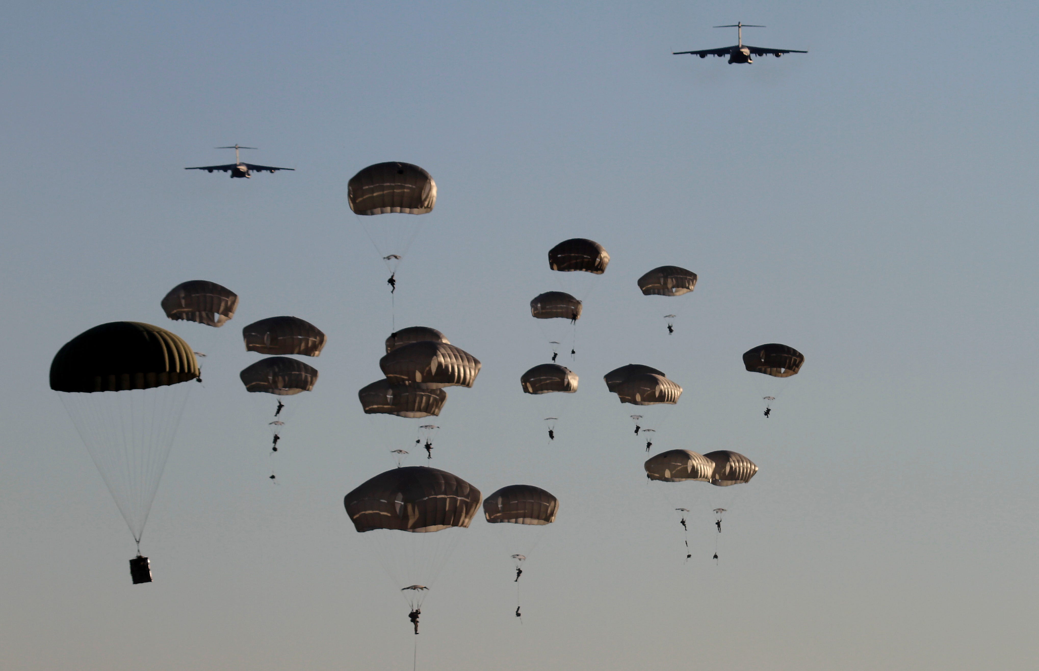 U.S. Army 82nd Airborne Division soldiers jump off a Boeing C-17 Globemaster III military transport aircraft during the Saber Strike 18 military exercise in Adazi Military Base, Latvia. The multinational exercise, organized by the Command of the U.S.