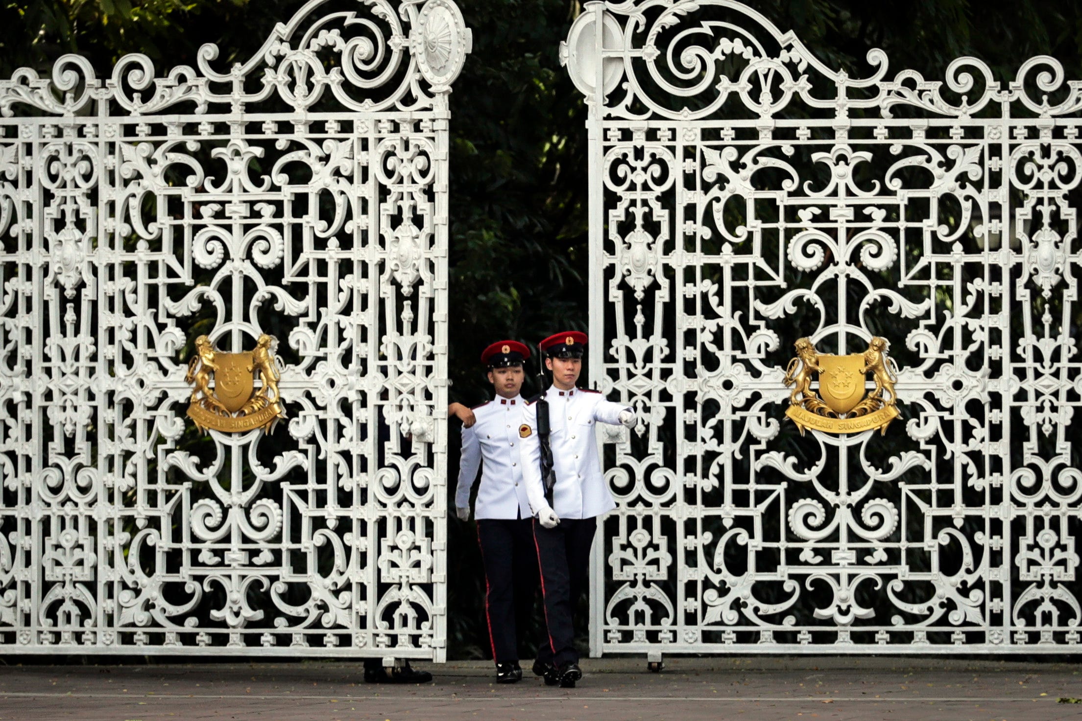 Singapore military personnel patrol in front of the gate of the Istana Presidential Palace, where North Korean Leader Kim Jong-un and Singapore Prime Minister Lee Hsien Loong will meet in Singapore. The North Korean leader is scheduled to meet on wit