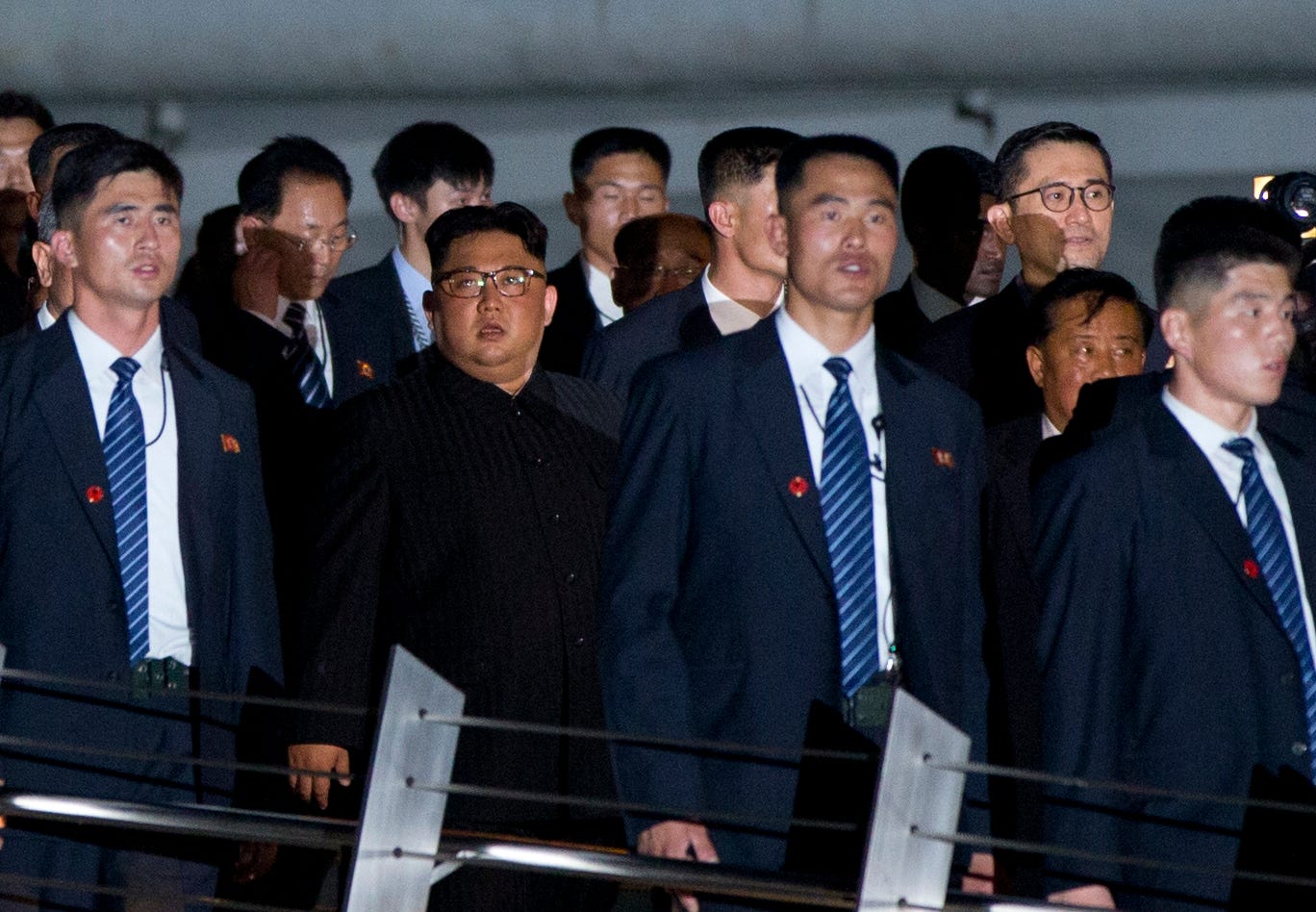 North Korean leader Kim Jong Un, center, walks in Marina Bay, Singapore, June 11, 2018 ahead of the summit with  President Trump.