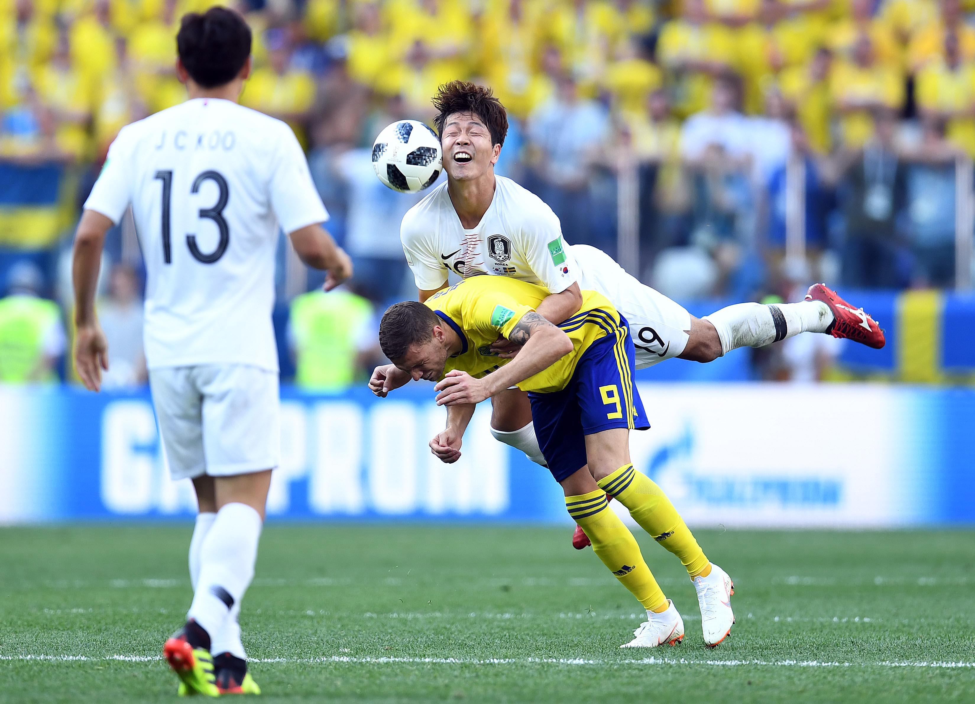 South Korea forward Kim Young-gwon and Sweden forward Marcus Berg go for the ball during the second half in Group F play during the FIFA World Cup 2018 at Nizhny Novgorod Stadium in Nizhny Novgorod, Russia.