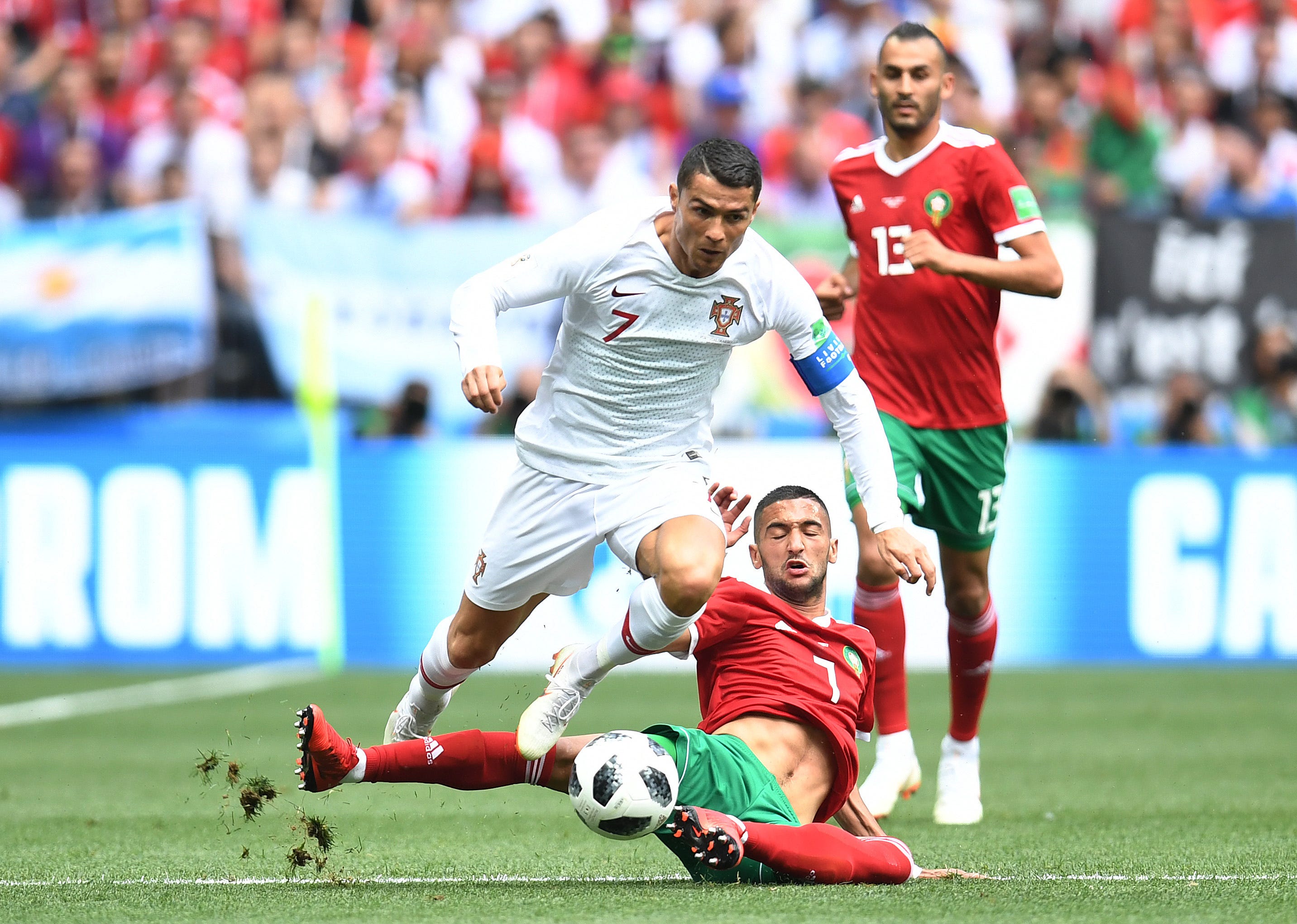 Portuguese forward Cristiano Ronaldo, left, avoids Morocco midfielder Hakim Ziyech in Group D play during the FIFA World Cup 2018 at Spartak Stadium in Moscow.