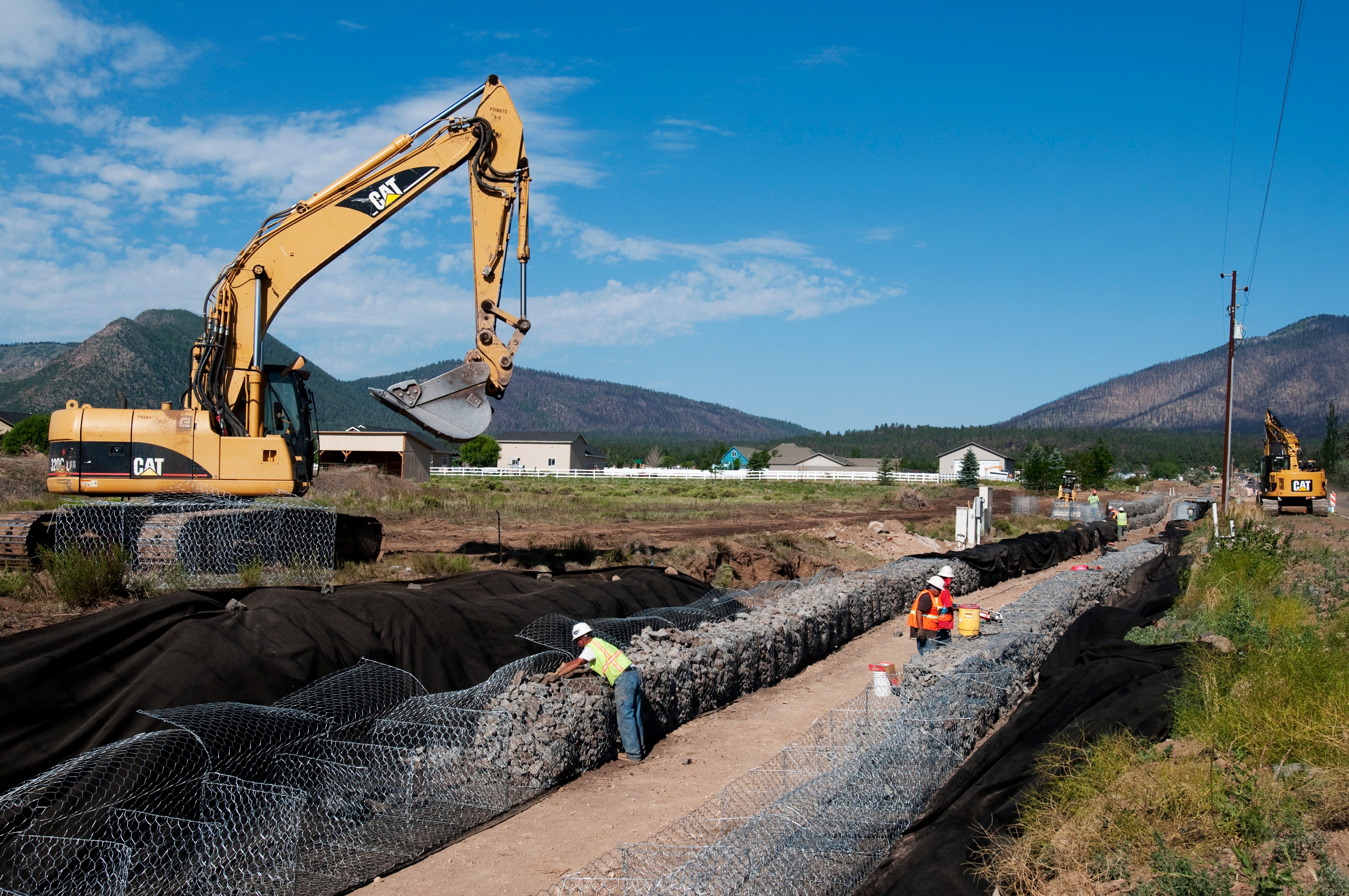 A water diversion canal was reinforced in case of future flooding one year after the Schultz Fire of 2010.