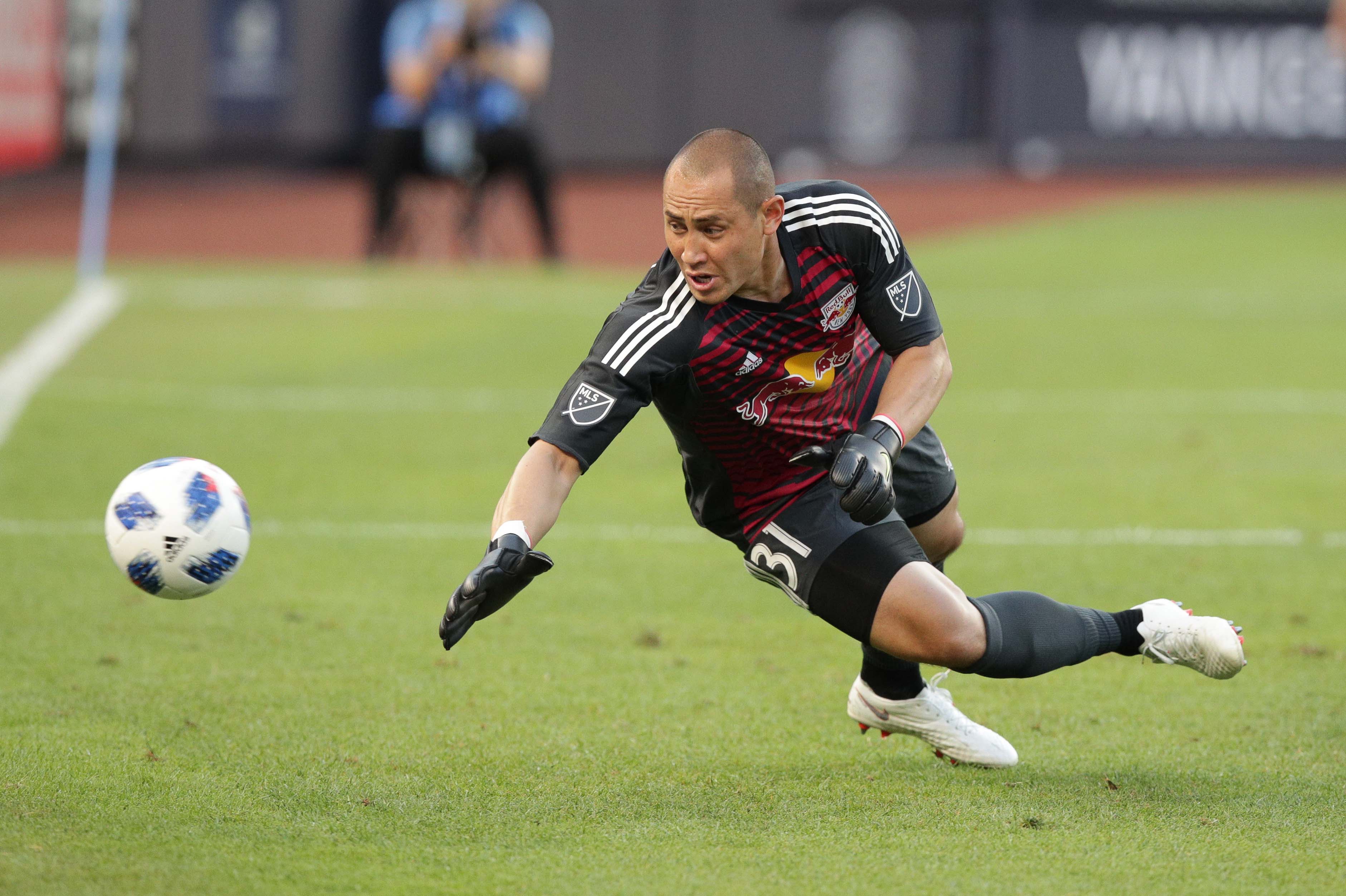 New York Red Bulls goalkeeper Luis Robles dives for a shot during the first half against New York City FC at Yankee Stadium.