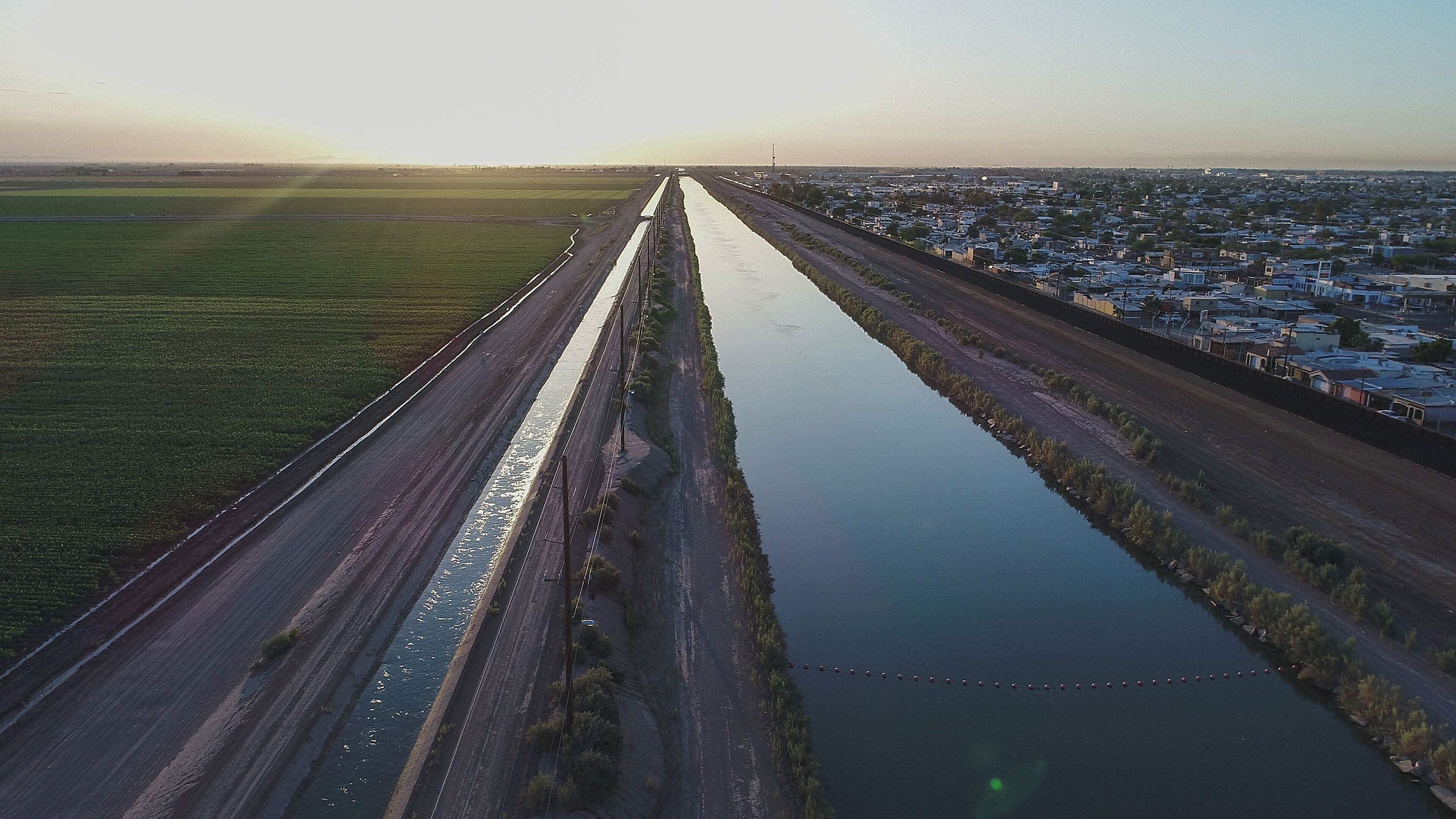 The All-American Canal runs along the U.S.-Mexico border outside Mexicali, bringing Colorado River water to the farm fields of California's Imperial Valley.