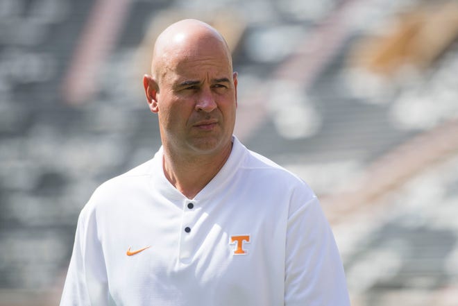University of Tennessee head coach Jeremy Pruitt walks on the field during media day in Neyland Stadium at University of Tennessee, Sun. Aug. 5, 2018.