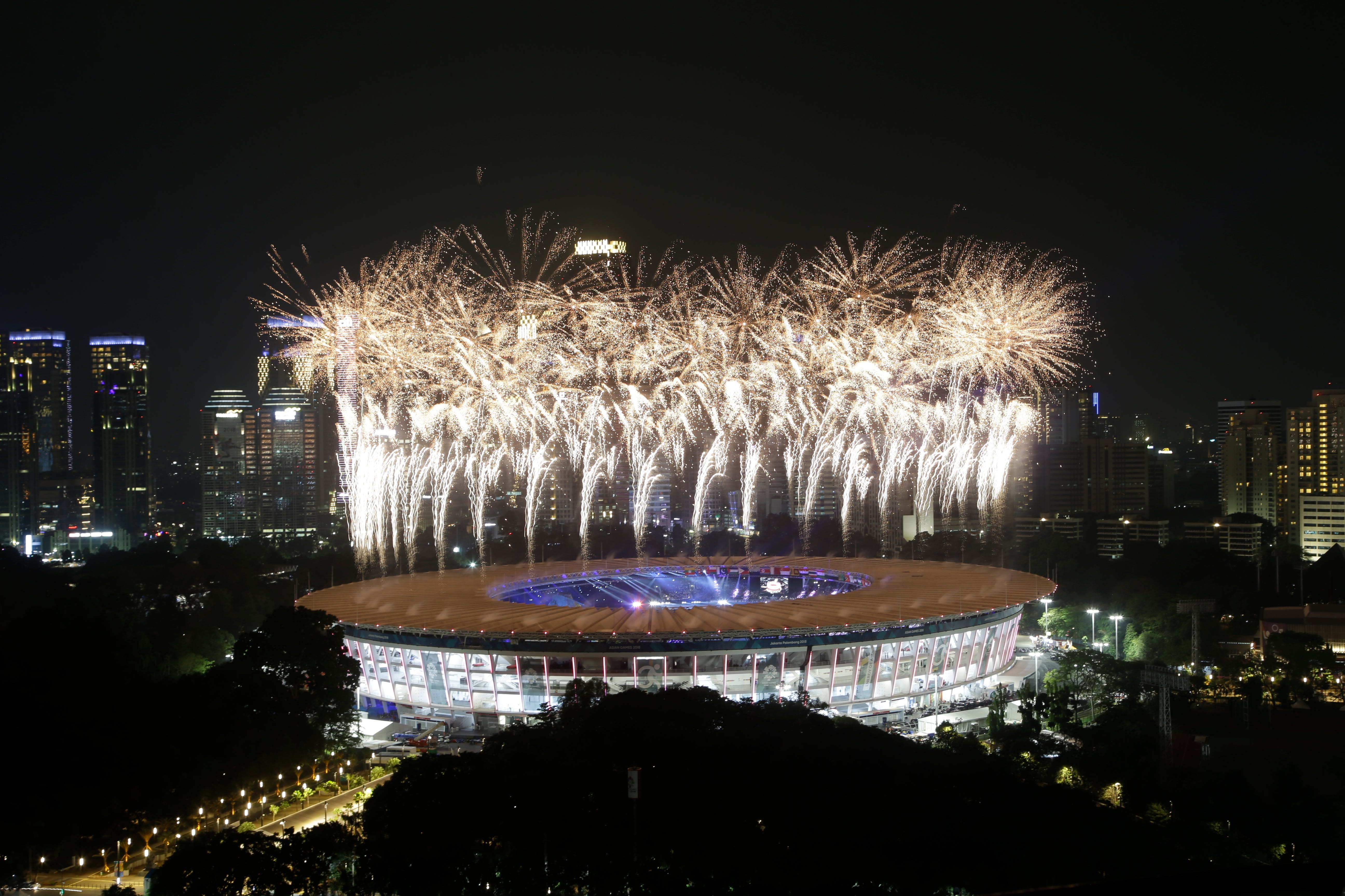 Fireworks explode over the Gelora Bung Karno Stadium during the opening ceremony for the 18th Asian Games in Jakarta, Indonesia, Aug. 18, 2018.