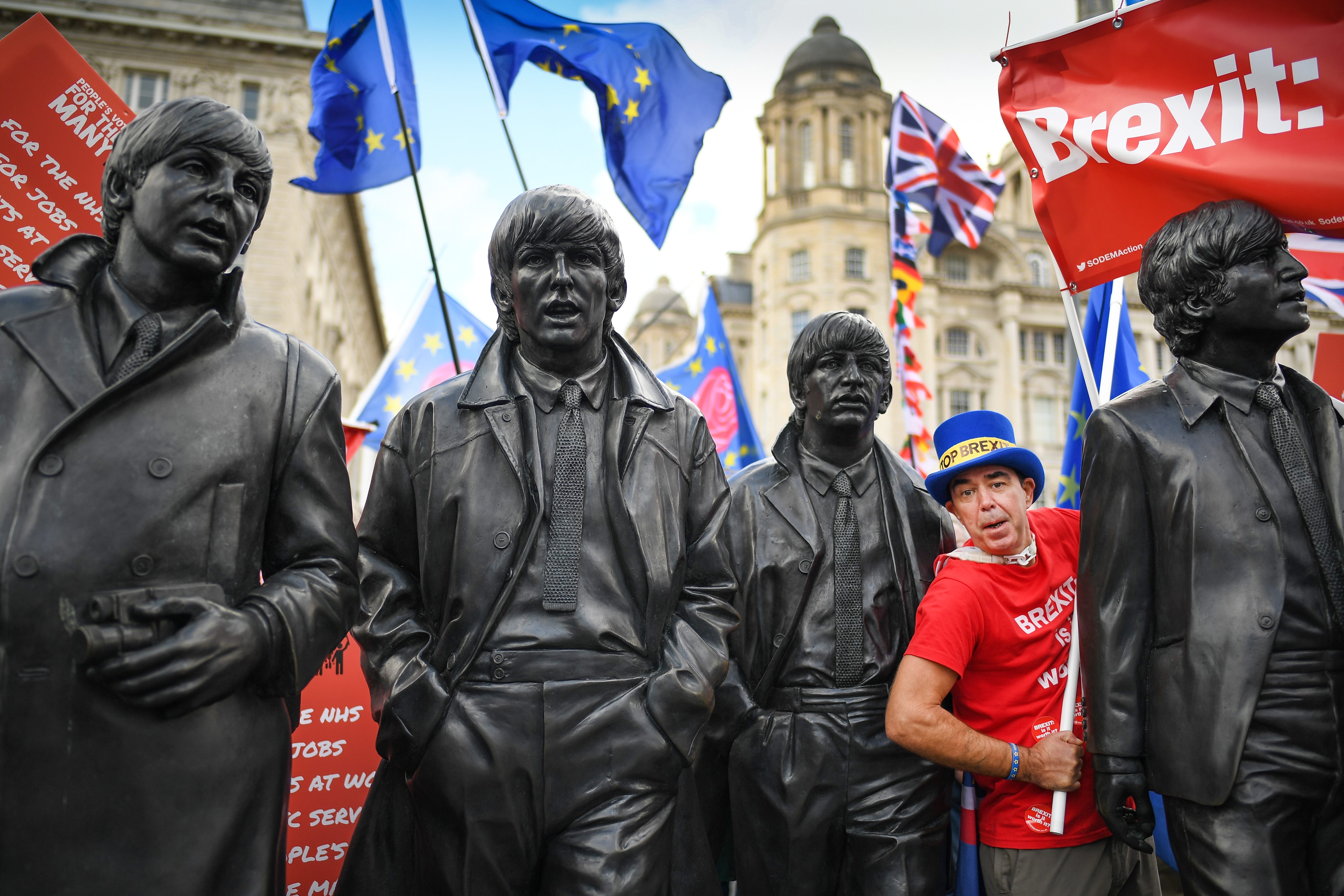 Demonstrators on the March For The Many pass the Beatles statues on Sept. 23, 2018 in Liverpool, England. The March For The Many is calling for a people's vote on the final outcome of the government's Brexit negotiations.
