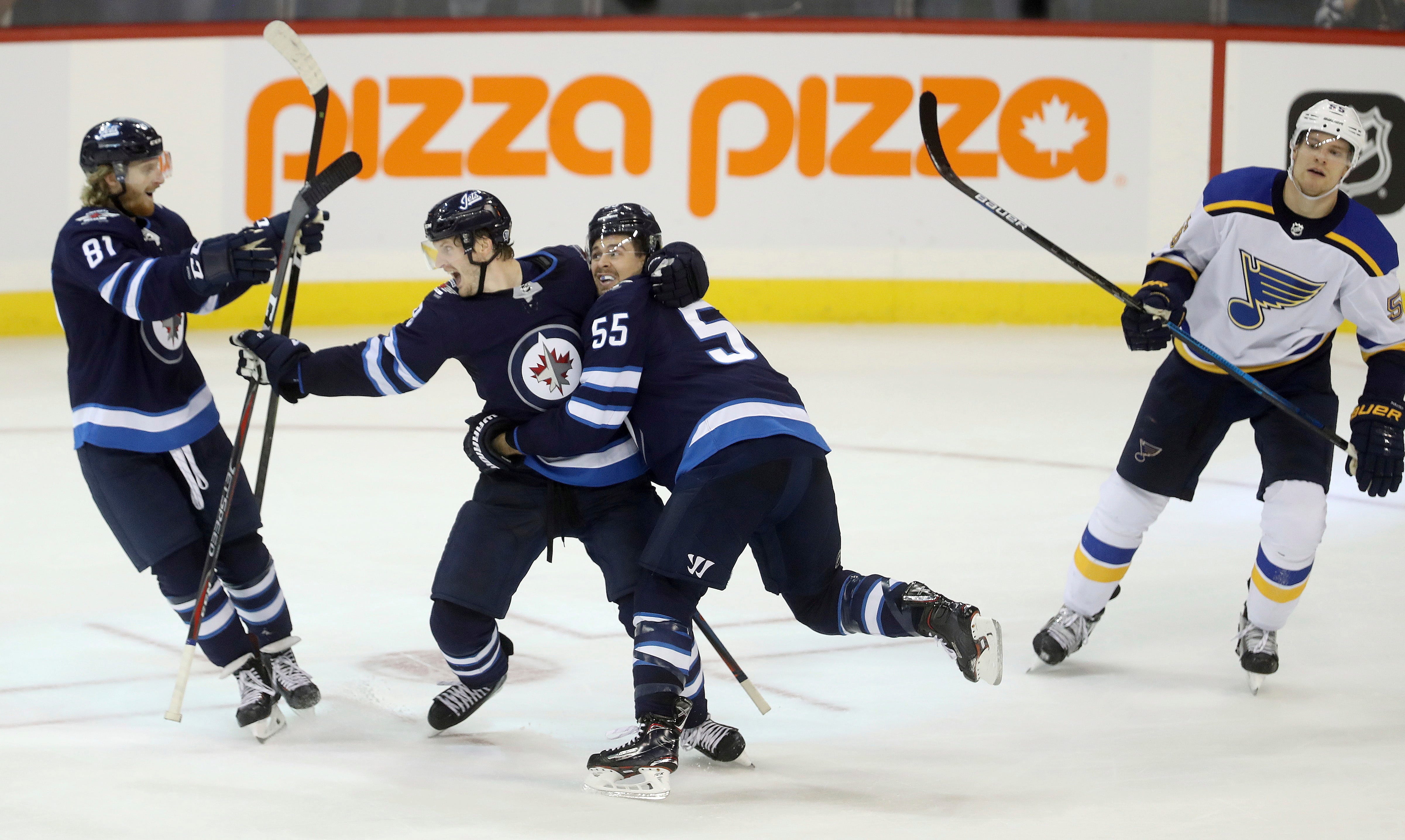 Trouba scores in OT to lift Jets over Blues 5-4