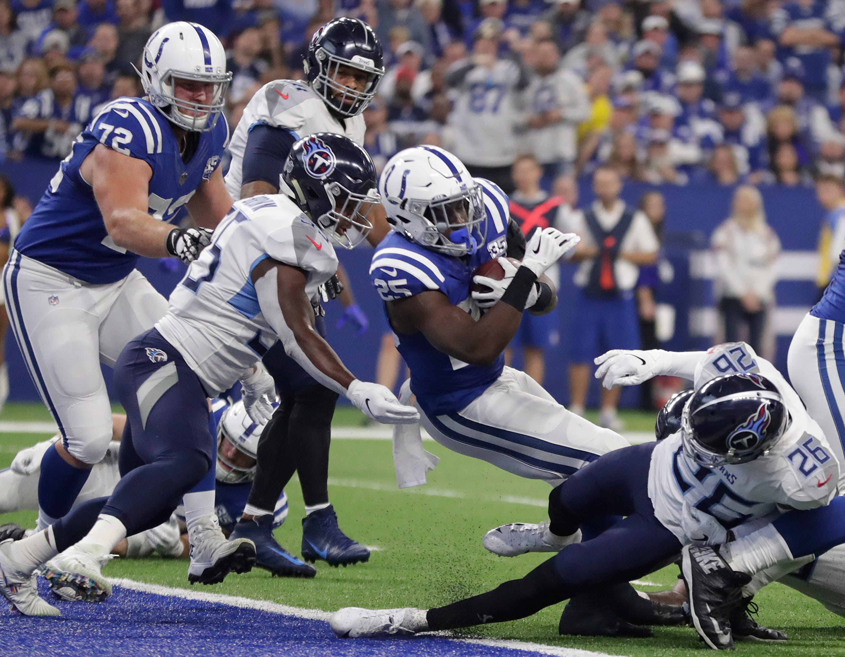 Luck keeps record perfect against Titans with 38-10 victory