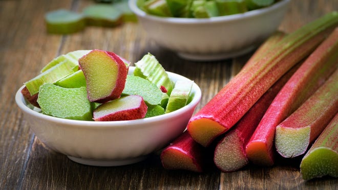 Rhubarb stalks, which look like overgrown red celery, are a vegetable usually treated as a fruit -- typically sweetened and baked into pies (often in combination with strawberries) or other desserts.