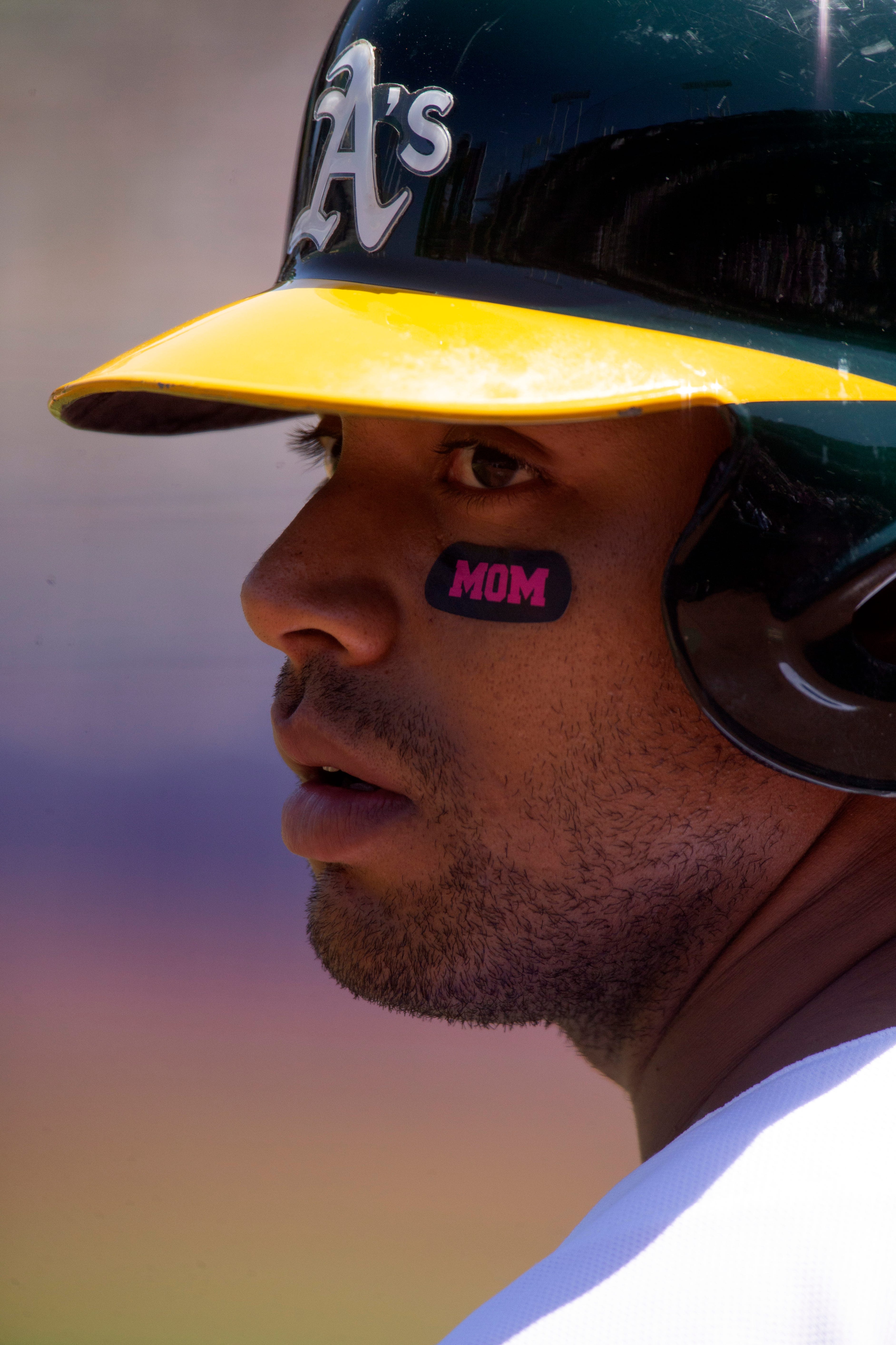 A's place Khris Davis on injured list with hip contusion