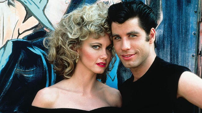 Olivia Newton-John starred opposite John Travolta in 1978's "Grease," sealing her pop-culture legacy.
