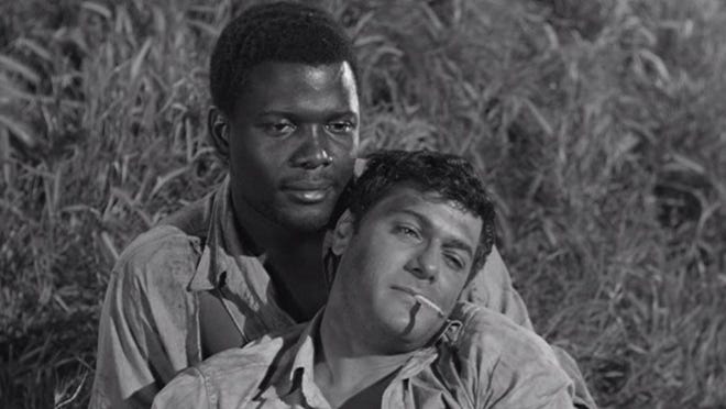 "The Defiant Ones" was Stanley Kramer's film about a white and black convict – Tony Curtis and Sidney Poitier – who must learn to work together after escaping custody while chained together.