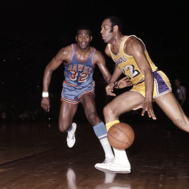 This file photo shows Atlanta Hawks forward Bill Bridges (32) defending Los Angeles Lakers guard Elgin Baylor (22) at The Forum in Los Angeles.