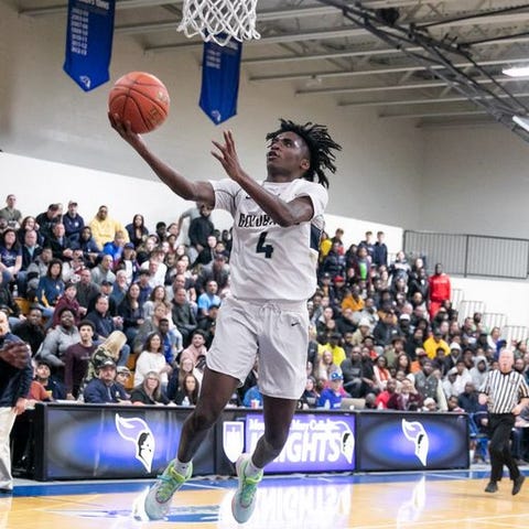 Newburgh's Jah'Likai King drives to the basket in 