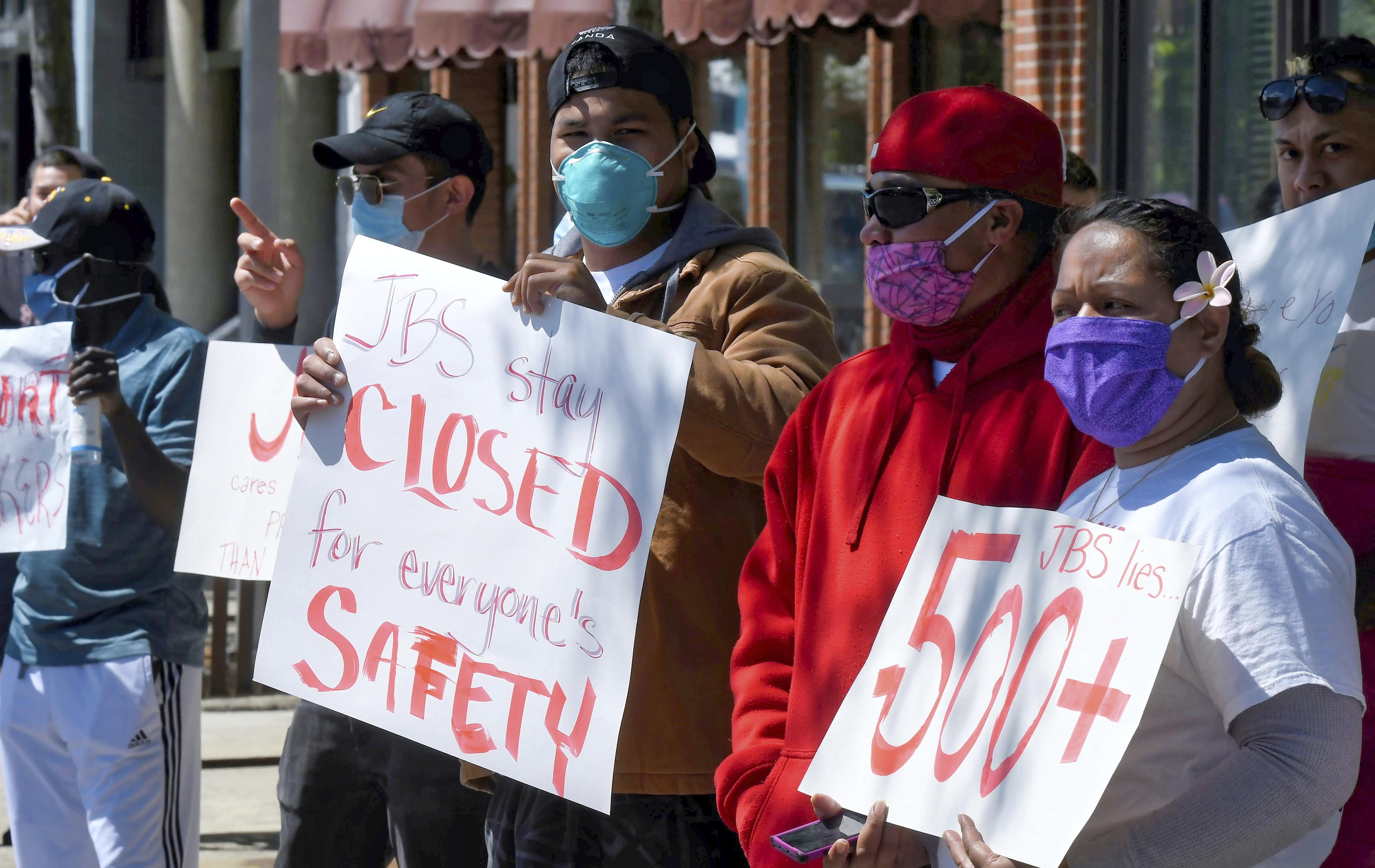 Workers at the JBS USA meatpacking plant protest in Logan, Utah, the company’s handling of a coronavirus outbreak that has resulted in nearly 300 confirmed cases.