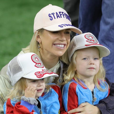 Kelly Stafford on the sideline with her twin daugh