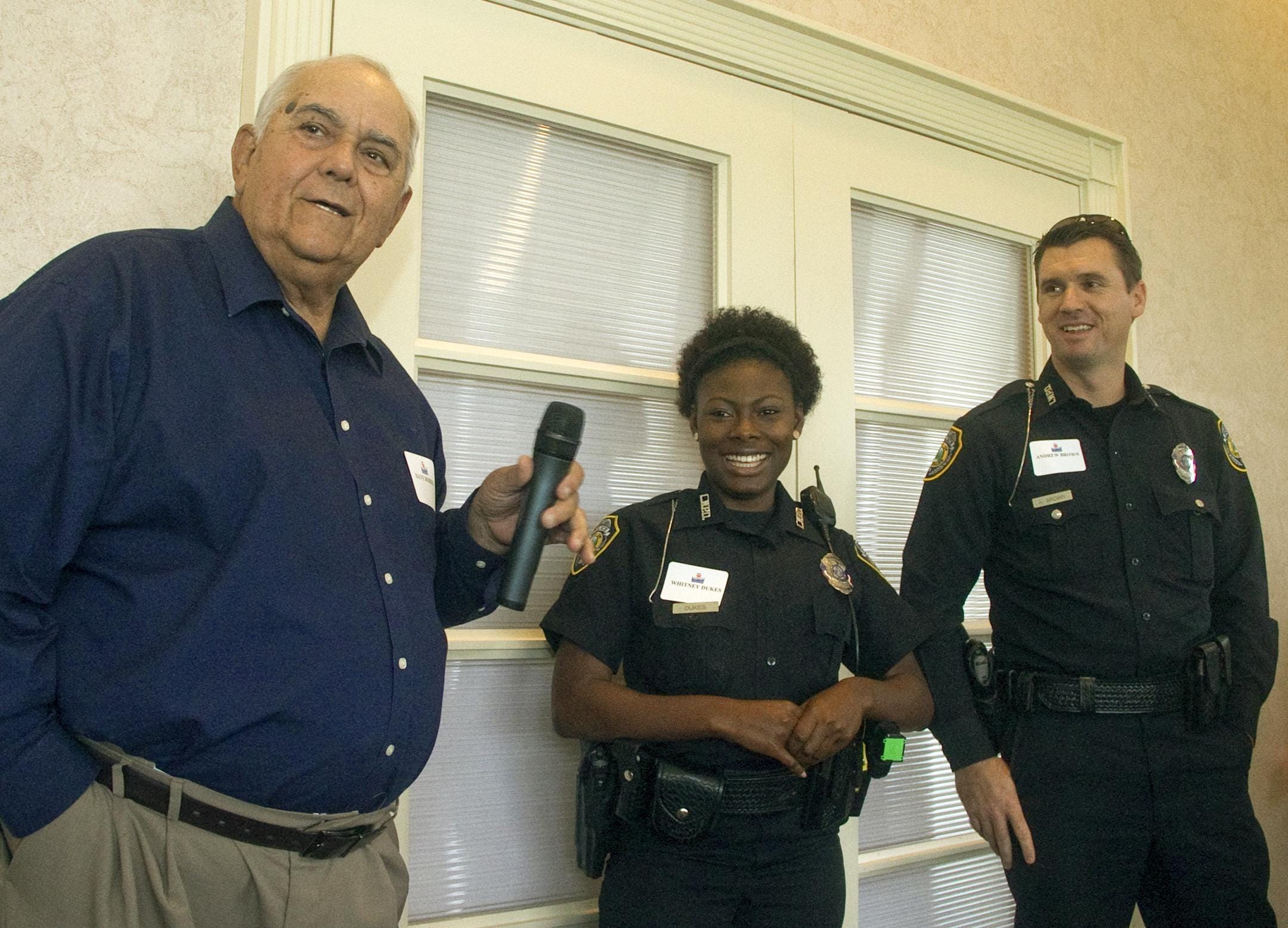 Whitney Dukes, center, then a Lake Wales, Florida police officer, alleged that Detective Travis Worley used a racial slur in 2016.