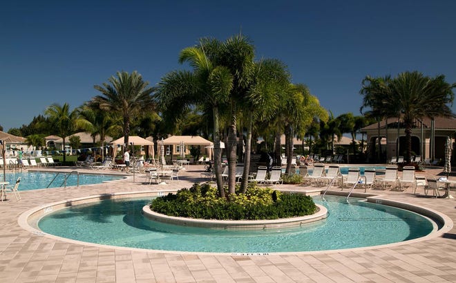 The clubhouse and swimming pools at Valencia Reserve in suburban Boynton Beach.