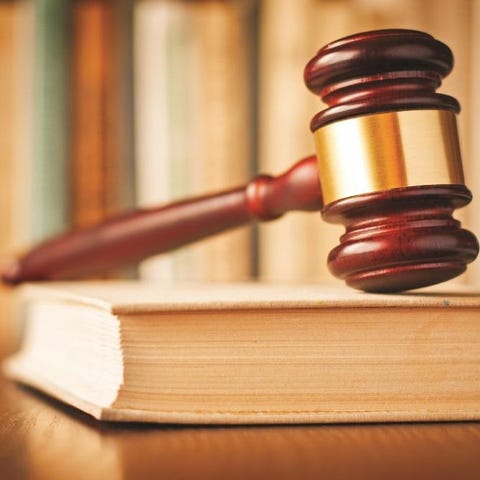 A gavel sits atop a book.
