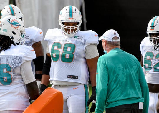 Former Ragin' Cajuns offensive lineman Robert Hunt of the Dolphins receives instruction during training camp in 2020. Hunt played all 16 games for Miami last season.