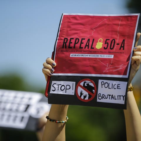 FILE-In this June 8, 2020 file photo, a protester 