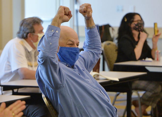 In June, Empower Erie board member Sam Talarico reacts after a positive vote during a virtual hearing with the Pennsylvania Board of Education that established the Erie County Community College.