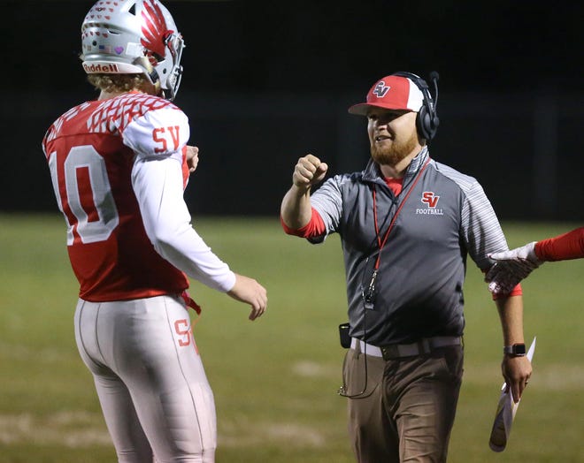 Sandy Valley´s Cameron Blair celebrates a touchdown with head coach Brian Gamble during the first quarter of their game against Strasburg at Sandy Valley on Friday, Oct. 11, 2019.