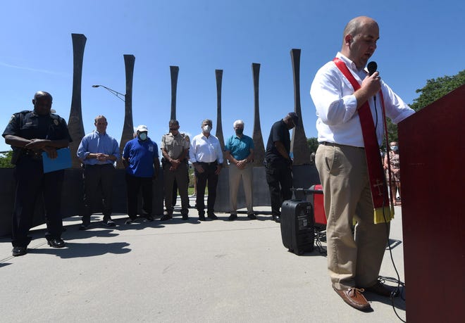 Pastor Brad McDowell of First Christian Church speaks at 1898 Memorial Park in 2020. Built in 2008, the park has become the focus of many events commemorating the 1898 coup and massacre.