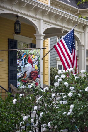 American flags and red-white-and-blue buntings hang from a house in Bristol.