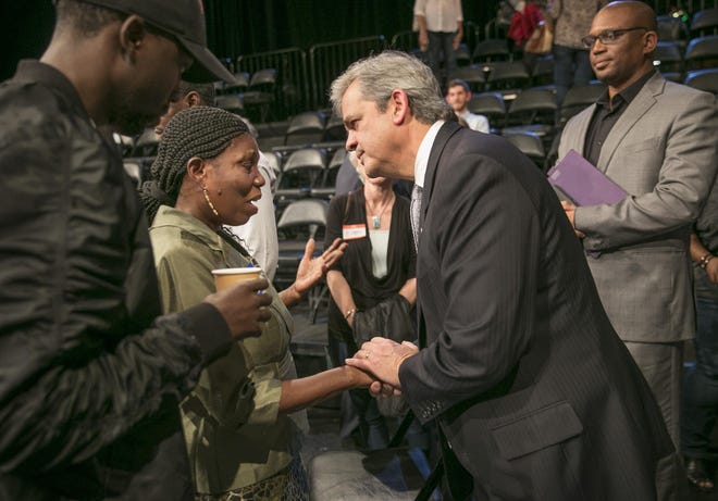 Mayor Steve Adler, right, talks to Ketty Sully, mother of David Joseph, at 'The Talk: A Community Forum' hosted by the Austin American-Statesman and KLRU in February 2017.