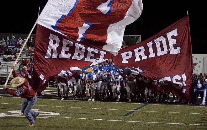 When the Hays High football team returns to the field in the fall, the school's Rebel mascot will be replaced by a Hays Hawk. Some community members and local business owners say they already are embracing the change and applaud the district’s efforts.