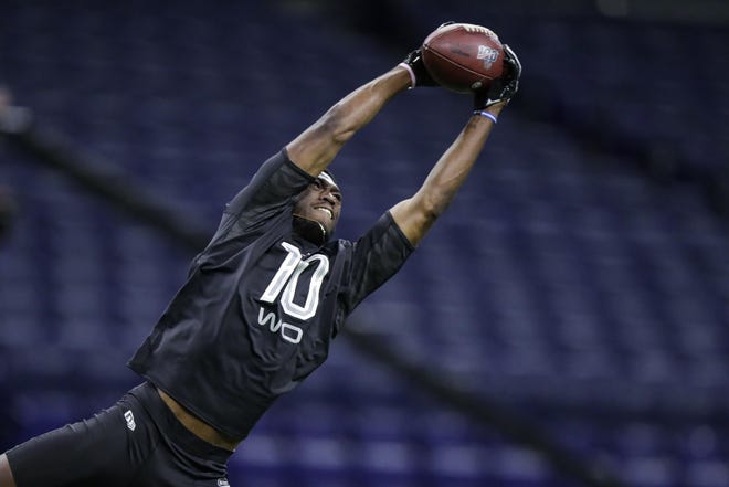 Rhode Island wide receiver Isaiah Coulter runs a drill at the NFL football scouting combine in Indianapolis, Thursday, Feb. 27, 2020.