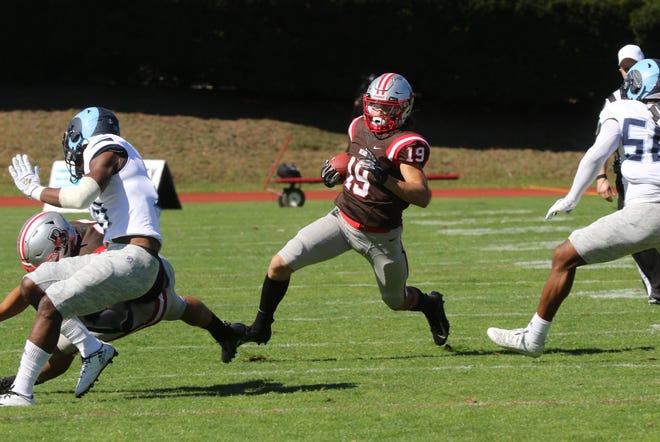 Brown's Jakob Prall looks for some running room against URI in last season's Governor's Cup game.