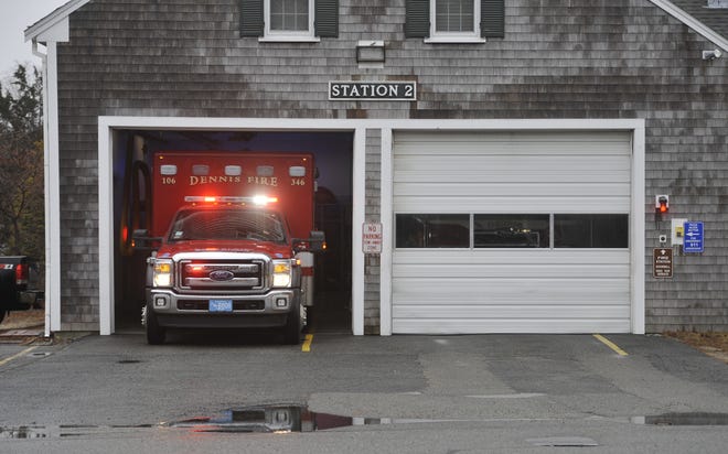 An ambulance crew heads out to a call from Dennis Fire Department's current Station 2 on Old Bass River Road. Town voters Tuesday approved an override to build a new $14.6 million replacement station on Paddocks Path.