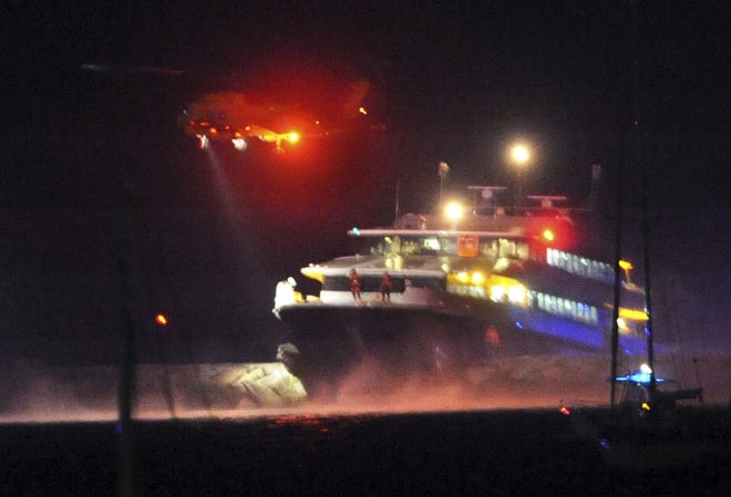 A Coast Guard helicopter evacuates passengers from the high-speed ferry Iyanough after it struck a breakwater in Hyannisport on June 16, 2017. Claims for injuries in connection with the crash in a lawsuit have been dismissed after parties reached a settlement.