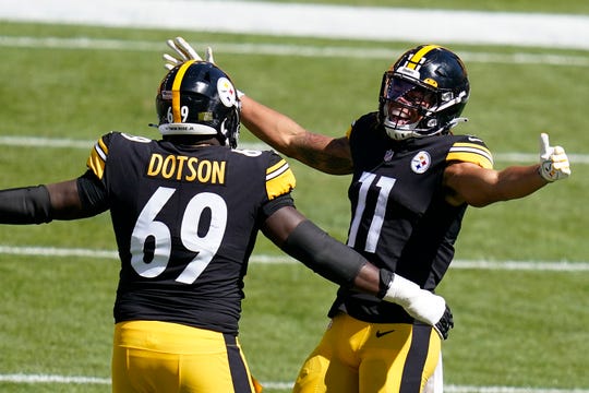 Former Cajuns offensive guard Kevin Dotson of the Steelers celebrates a touchdown with wide receiver Chase Claypool (11) last season in Pittsburgh.