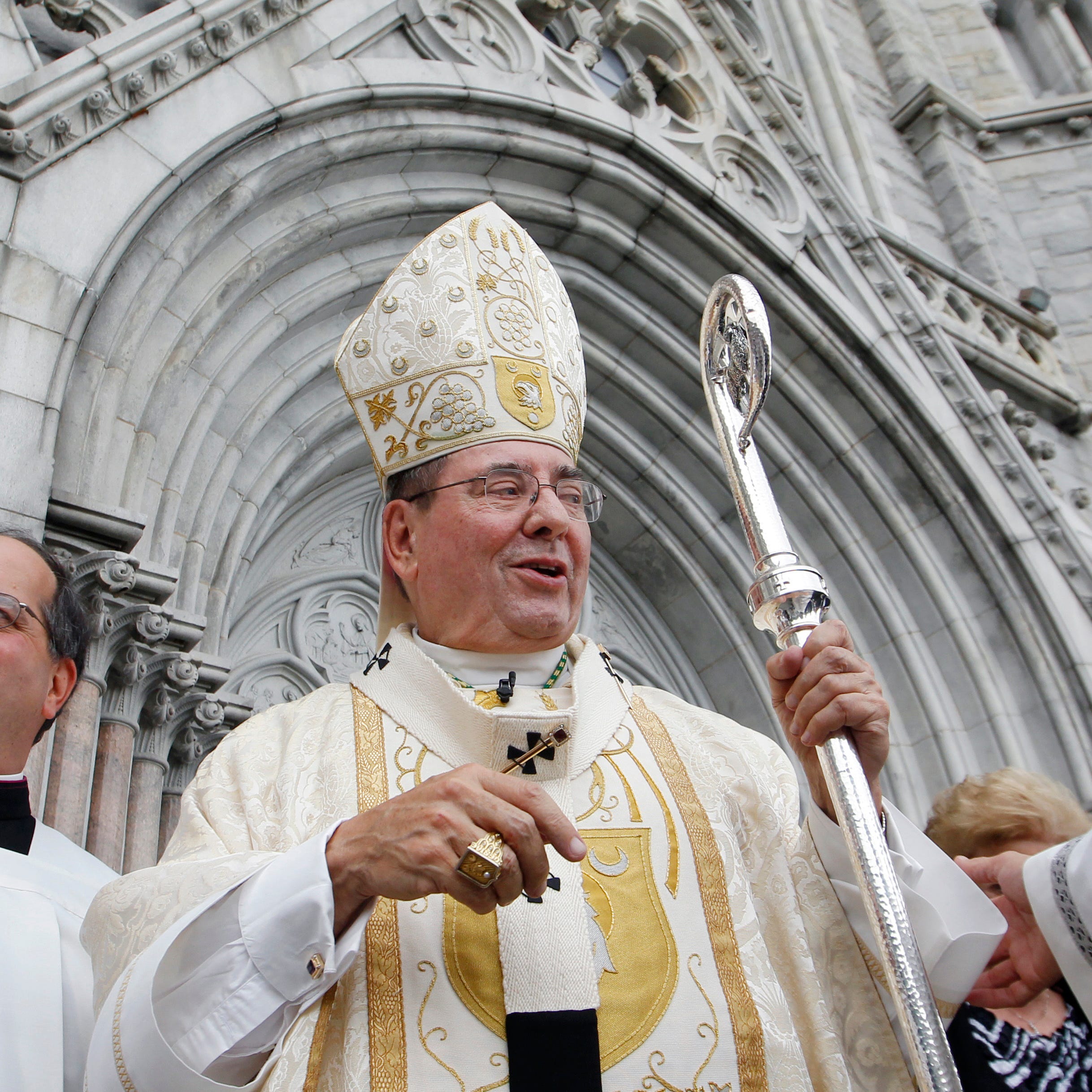 Archbishop John J. Myers stands outside Cathedral Basilica of the Sacred Heart, Saturday, Sept. 22, 2012, in Newark, N.J. Hundreds of parishioners and clergy members packed the church to mark the 25th anniversary of Bishop John Myers' episcopal consecration.