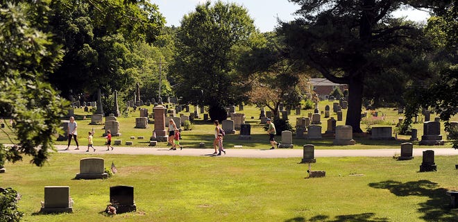 People walk, jog, and bike  through the Evergreen Cemetery in Medway, July 2, 2020.