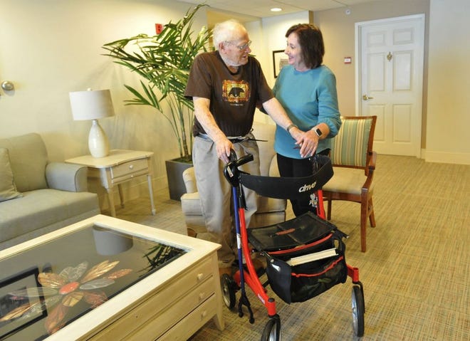 Norwell Visiting Nurse Association home care nurse Gerry Sanderson helps Allerton House resident Robert Hannon at the Hingham facility in early March before the pandemic began.