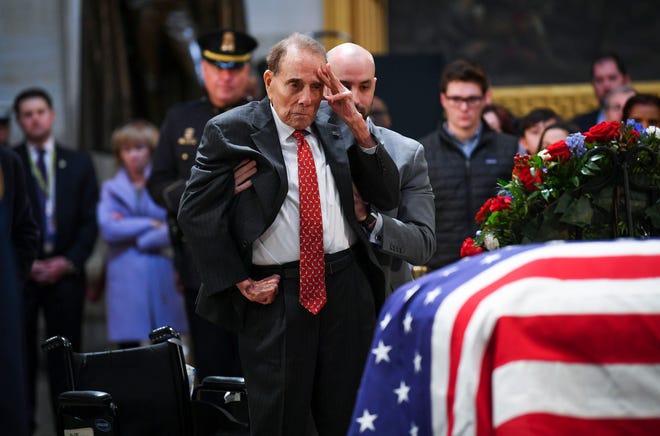 Bob Dole, the elder statesman of Kansas Republican politics after his 27-year tenure in the U.S. Senate, announced Tuesday he would back Derek Schmidt in the 2022 governor's race.