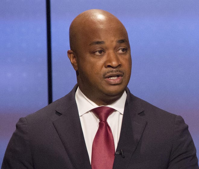 Kwanza Hall (left) answered a question while Vincent Fort listened during the Atlanta Police Foundation's Atlanta Mayoral debate hosted by WSB-TV at their studios in Atlanta on Sunday October 22nd, 2017. Crime and safety were the main topic of discussion during live debate. (Photo by Phil Skinner).