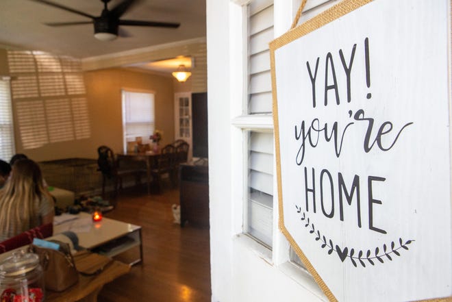 A sign invites potential homebuyers into a house in Shawnee County being marketed for sale in May 2020. Schools tend to be among the first things people ask about when they're looking to buy a house here, local Realtors say. [May 2020 file photo/The Capital-Journal]